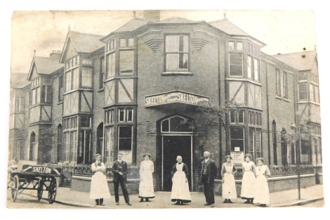 A 20thC Lincoln city postcard, Skelton coffee shop front with workers, Canwick Road.