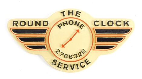 A Round The Clock Phone Service sign, with raised black lettering, numbered 2766326, 32cm wide.