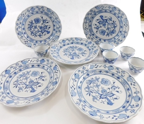 A Meissen blue and white part service, onion plate, cups, plates 23cm wide decorated with flowers, blue and white, and other associated pieces. (a quantity)