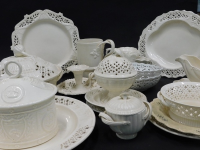 Various Royal Creamware pottery, to include a double strap work handled mug, 18cm high, lidded vegetable dish on stand, various other pierced items, bowls, lidded vase, etc. (a quantity)