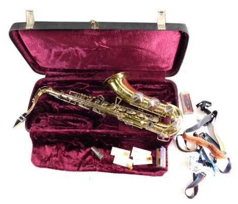 A Corton by Amati brass saxophone, with chrome and mother of pearl finish mounts, with removable mouthpiece, and a small quantity of other accessories, in fitted case, the case 91cm wide.