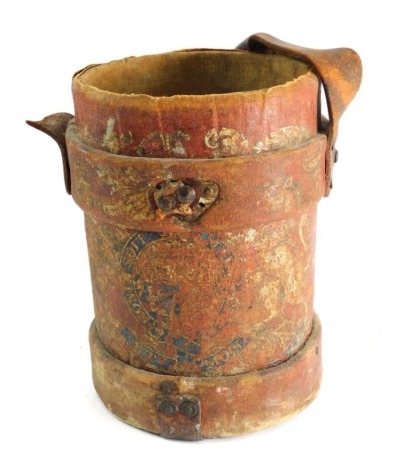 A leather artillery shell carrier, of cylindrical form with handle, with partial crest in colours, 32cm high. (AF)