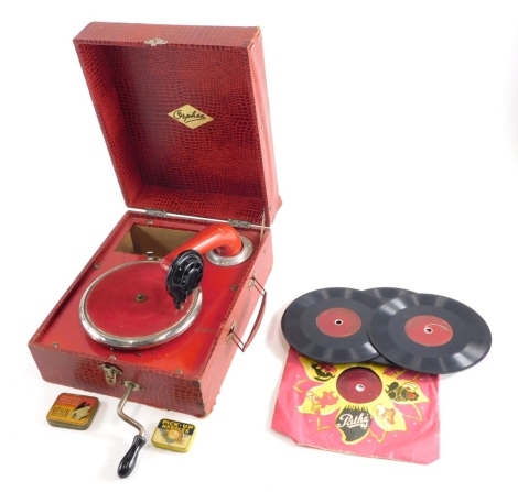 A mid 20thC child's gramophone, in pressed board case, with paper decoration marked OYAHEE, with baize lined chrome plated turntable, articulated arm and a small quantity of records, 25cm wide. (AF)