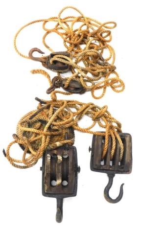 A ship's rope pulley, with oak section, block and tackle style, with metal hook and heavy rope, the pulley sections 17cm wide, etc. (a quantity)