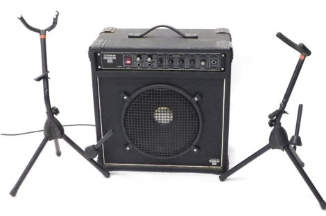 A Torque T 50k amplifier, with front grill speaker 53cm high 48cm wide 27cm deep.