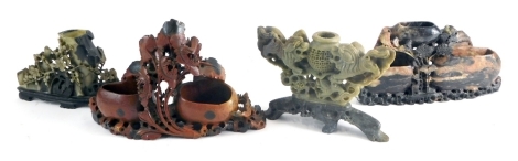 Various soapstone carvings, floral carved vase with lions centred by urn 16cm high and three others (4).