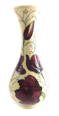 A Moorcroft Chocolate Cosmos pattern vase, decorated with Poppies on cream ground dated 2013, 19cm high.