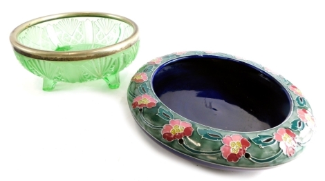 A Bourne Denby pottery bowl, with a band of flowers on a green and blue ground, unmarked, paper label beneath 29cm diameter and a green glass bowl. (2)