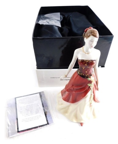 A Royal Doulton Pretty Ladies figure of Emily, figure of the year 2006 printed marks beneath 17cm. high. (boxed with certificate)