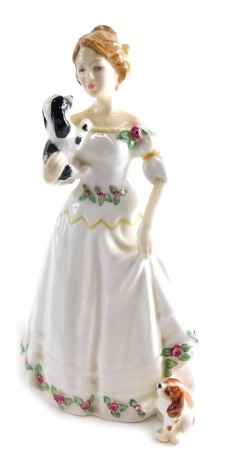 A Royal Doulton figure, Take Me Home HN3662 printed marks beneath, 21cm high.