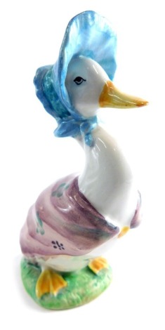 A Beswick pottery Beatrix Potter figure Jemima Puddleduck, gold oval mark beneath, 11cm high.