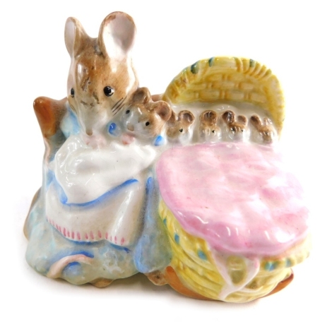 A Beswick pottery Beatrix Potter figure Hunca Munca, gold oval mark beneath, 8cm high.