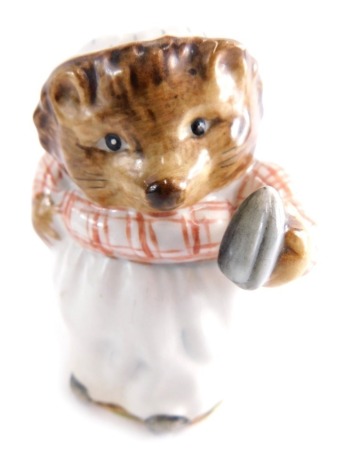 A Beswick pottery Beatrix Potter figure Mrs Tiggy Winkle, gold oval mark beneath, 9cm high.