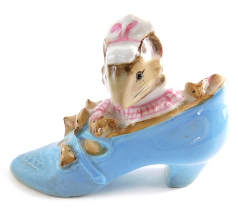 A Beswick pottery Beatrix Potter figure The Old Woman Who Lived In A Shoe, gold oval mark beneath, 6cm high.