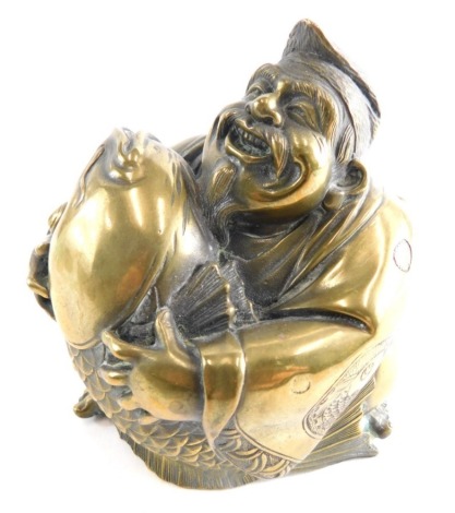 A bronze figure of a bearded Chinese fisherman holding enlarged fish, unmarked, 15cm high.