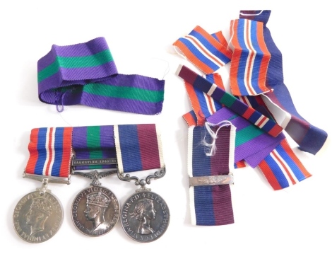 A 20thC medal trio, 1939-1945 World War II Campaign medal, George VI medal with Palestine 1945-1946 clasp marked 181988 COL. J H HERD R.A.F a Long Service and Good Conduct medal similarly marked with associated ribbons etc.