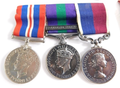 A 20thC medal trio, 1939-1945 World War II Campaign medal, George VI medal with Palestine 1945-1946 clasp marked 181988 COL. J H HERD R.A.F a Long Service and Good Conduct medal similarly marked with associated ribbons etc. - 2