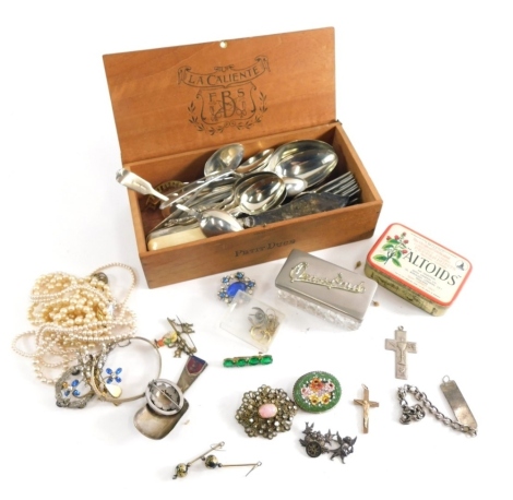 Various cap badges, metal Border badge 6cm wide, glass box, various costume jewellery and effects, faux pearls, silver plated flatware some with bone handles, other silver plated spoons fiddle pattern old English pattern contained in an La Caliente box.