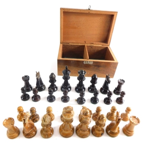 A 20thC carved wooden chess set, with white 8cm high king, various pieces in fitted box, (a quantity).