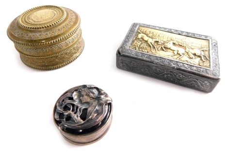 A pewter and brass snuff box, together with a silver pill box, and a brass box.