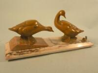 T. Rochard. An Art Deco painted spelter group of two ducks and a snail