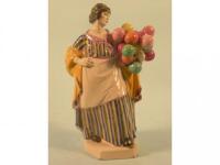 A Charles Vyse Chelsea Pottery figure of a female Balloon Seller