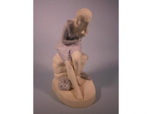 A Victorian Mintons Parian figure of a seated lady after John Bell