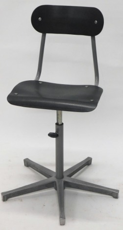 An early 20thC industrial machinist Singer style chair, with oblong back in grey metal with shaped seat articulated and adjustable stem on a five spoke base unmarked 57cm wide.