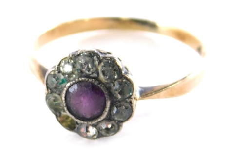 A cluster ring, set with amethyst and cz stones, in a floral cluster, on a rose gold band stamped 9ct, ring size M½, 1.5g all in.