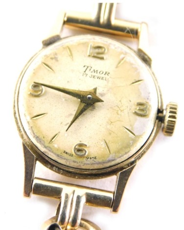 A 9ct gold Timor ladies wristwatch, with V splayed bracelet and safety chain, lacking glass covering, 12.8g all in.