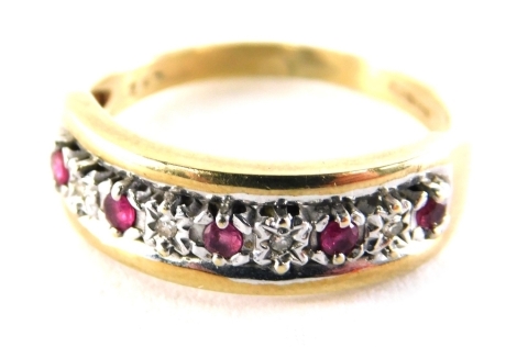 A 9ct gold half hoop dress ring, set with five garnets and five czs each in claw setting, ring size O, 3.1g all in.