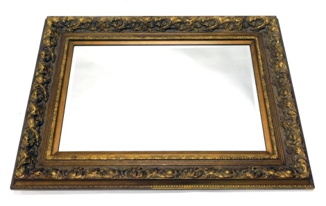 A giltwood rococo style mirror, with bevel glass, 93cm x 122cm.