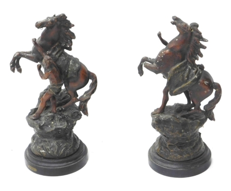 After Mollais. A pair of early 20thC spelter Marly horses, on ebonised plinths, 46cm high.