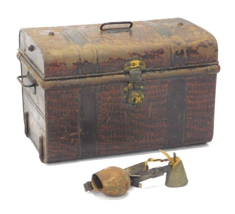 An early 20thC domed top tin trunk, with shaped carrying handles, 35cm high, 59cm wide, 38cm deep.