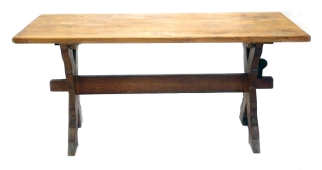 A 20thC oak refectory table, on shaped legs joined by heavy stretcher, 78cm high, 166cm wide, 85cm deep.