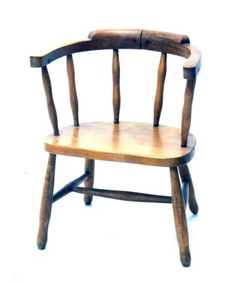 A 20thC ash and elm small captains chair, with spindle back, turned legs, and H stretcher, 51cm high.