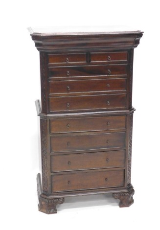 A 20thC mahogany chest on chest, of small proportion, with two short and seven long cock beaded drawers, flanked by blind fret work, on bracket feet, 100cm high, 58cm wide, 33cm deep.