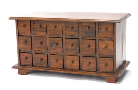 A 20thC spice cabinet, with an arrangement of eighteen drawers, 35cm high, 68cm wide, 30cm deep.