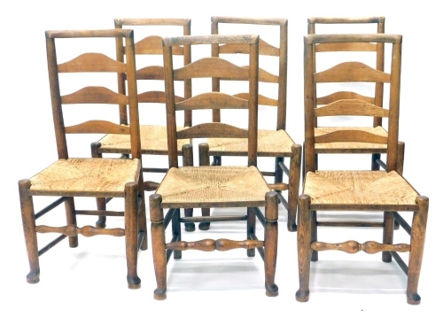 A set of six 19thC Lancashire ash and elm ladder back chars, each with rope seats on turned legs, terminating in front pad feet, 101cm high, etc. (6, AF)