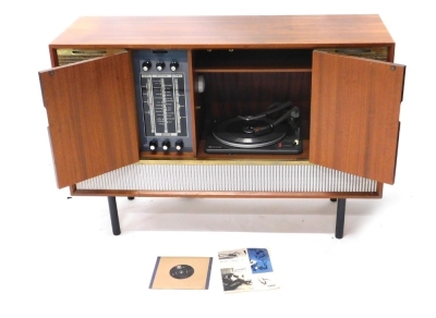 A Decca walnut cased radiogram, with Garrard turntable, 31cm wide, and Decca system, on turned legs, the cabinet 73cm high, 108cm wide, 38cm deep.