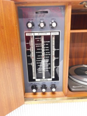 A Decca walnut cased radiogram, with Garrard turntable, 31cm wide, and Decca system, on turned legs, the cabinet 73cm high, 108cm wide, 38cm deep. - 3