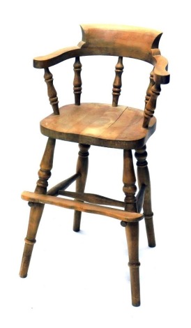 A 20thC beech child's high chair, 82cm high.