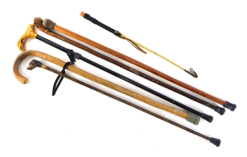 Various walking sticks, to include a dog head example, with turned bamboo style stem, 85cm high, hunting whip, etc. (a quantity)