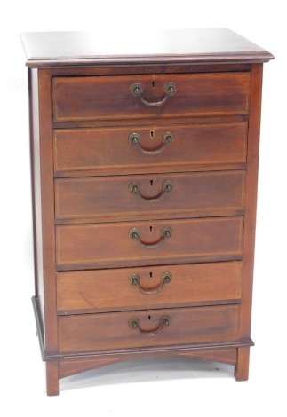 An Edwardian mahogany and boxwood strung music cabinet, with six drawers, on rectangular stiles, 81cm high, 52cm wide, 36cm deep.