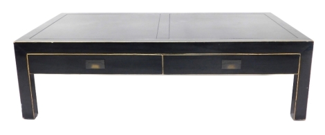 An Eastern inspired ebonised low coffee table, with two frieze drawers with brass handles, 60cm high, 140cm wide, 80cm deep.