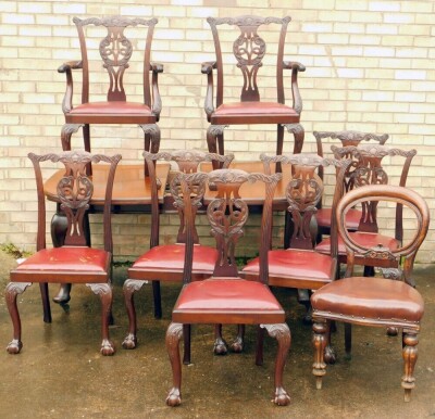 A Chippendale designed mahogany dining room suite, comprising extending D end table, on heavy cabriole legs terminating in pad feet and castors, and a set of eight (6+2) Chippendale design dining chairs, with carved back splats, drop in seats in red leath