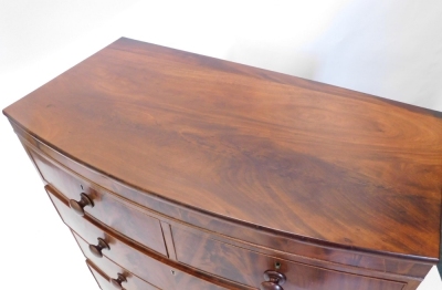 A Victorian mahogany bow fronted chest of two short and three long cock beaded drawers, on triple bun feet, 110cm high, 102cm wide, 49cm deep. - 2