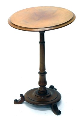 A 19thC occasional table, the circular top on baluster stem and circular platform base, terminating in scroll feet, 72cm high, 48cm diameter.