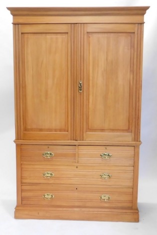 An Edwardian satin walnut bedroom pair, comprising press cupboard, with fitted interior, above two short and two long drawers, on a block base and a dressing chest with a mirror with a dentil frieze, flanked by plain columns, above three drawers on bracke