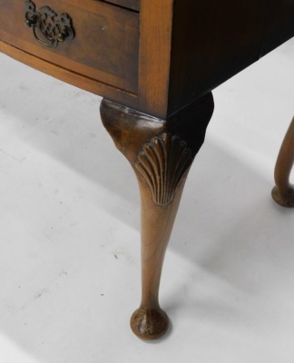 A 20thC walnut writing desk, with later tooled leather top, above central drawer flanked by four further drawers, on cabriole legs terminating in pad feet, 78cm high, 103cm wide, 51cm deep. - 3